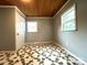 This bedroom features a stained wood ceiling and two windows at 2328 Milton Ave, Gastonia, NC 28052