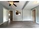 Comfortable living area with wood flooring and neutral walls; doorways leading to other rooms add depth at 2328 Milton Ave, Gastonia, NC 28052