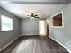 Spacious living room with wood-look floors, neutral walls, and natural light, creating an inviting space at 2328 Milton Ave, Gastonia, NC 28052