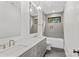 Bathroom features double sink vanity, modern lighting, and a sleek shower/tub combination at 242 Shoreline Loop, Mooresville, NC 28117