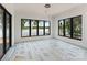 Spacious room with lots of light, neutral walls, black trim windows, and lake views at 242 Shoreline Loop, Mooresville, NC 28117