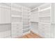 Spacious walk-in closet features custom shelving, drawers, and ample storage space at 242 Shoreline Loop, Mooresville, NC 28117