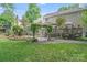 Spacious backyard featuring a deck, stone patio, and lush landscaping at 2635 Cotton Planter Ln, Charlotte, NC 28270