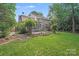 Expansive backyard featuring deck, patio, screened porch, and garden at 2635 Cotton Planter Ln, Charlotte, NC 28270