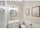 Bathroom featuring a sink with storage, neutral paint and framed wall art at 2635 Cotton Planter Ln, Charlotte, NC 28270