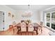 Elegant dining room featuring a chandelier, large window, and stylish decor at 2635 Cotton Planter Ln, Charlotte, NC 28270