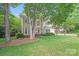 Inviting traditional home featuring manicured lawn, mature trees, and charming curb appeal at 2635 Cotton Planter Ln, Charlotte, NC 28270