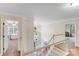 Bright hallway with staircase and views to the front entrance and bedroom at 2635 Cotton Planter Ln, Charlotte, NC 28270