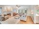 Cozy living room with a fireplace, hardwood floors, and comfortable seating at 2635 Cotton Planter Ln, Charlotte, NC 28270