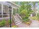 View of the screened porch entry and surrounding landscaping at 2635 Cotton Planter Ln, Charlotte, NC 28270