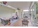 Sunroom featuring wicker furniture, tile floors, and multiple windows for natural light at 2635 Cotton Planter Ln, Charlotte, NC 28270