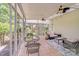 Sunroom with tile flooring, wicker furniture, ceiling fans and an outdoor view at 2635 Cotton Planter Ln, Charlotte, NC 28270