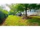 Large backyard featuring a well-kept lawn and mature landscaping at 282 Fischer Rd, Fort Mill, SC 29175