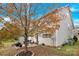 A charming backyard featuring mature trees, a patio with seating, and well-maintained landscaping at 282 Fischer Rd, Fort Mill, SC 29175
