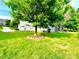 Beautiful backyard with mature trees and a well-manicured lawn at 282 Fischer Rd, Fort Mill, SC 29175