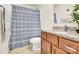 Bathroom features a shower with gray curtain, granite countertop vanity, and large mirror at 282 Fischer Rd, Fort Mill, SC 29175