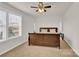 Bedroom features a dark wood bed frame, two white lamps, and a ceiling fan at 282 Fischer Rd, Fort Mill, SC 29175