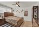 Comfortable bedroom with ceiling fan, large bed, dresser, and soft neutral carpet at 282 Fischer Rd, Fort Mill, SC 29175