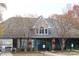 A well-maintained community center featuring ample windows, mature trees, and accessible entrance at 282 Fischer Rd, Fort Mill, SC 29175