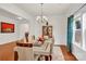 Bright dining room featuring hardwood floors, modern lighting, and large window at 282 Fischer Rd, Fort Mill, SC 29175