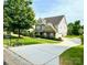 Beautiful home with a long driveway and well-maintained landscaping at 282 Fischer Rd, Fort Mill, SC 29175