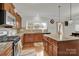 Well-lit kitchen showcasing granite countertops, modern appliances, and eat-in island at 282 Fischer Rd, Fort Mill, SC 29175