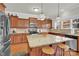 Bright kitchen features an eat-in island with decorative pendant lighting and stainless appliances at 282 Fischer Rd, Fort Mill, SC 29175