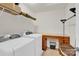 Bright laundry room features an overhead shelf and Whirlpool washer and dryer at 282 Fischer Rd, Fort Mill, SC 29175