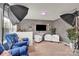 Bright living room features gray walls, plants, and is staged with contemporary furniture at 282 Fischer Rd, Fort Mill, SC 29175