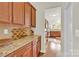 Butler's pantry featuring granite countertops and matching cabinetry, perfect for entertaining at 282 Fischer Rd, Fort Mill, SC 29175