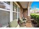 Inviting front porch with comfortable seating, brick columns, and serene view of the neighborhood at 282 Fischer Rd, Fort Mill, SC 29175