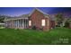 Charming brick home with a screened-in porch, perfect for enjoying outdoor living at 2910 Lake James Ct, Monroe, NC 28110