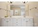 Bathroom with double vanity sinks, granite countertop and large mirror at 2910 Lake James Ct, Monroe, NC 28110