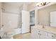 Bathroom with tile floor, shower-tub combination, vanity, and view to a carpeted room at 2910 Lake James Ct, Monroe, NC 28110
