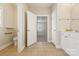Bathroom featuring tile flooring, double vanity, toilet and doorway to bedroom at 2910 Lake James Ct, Monroe, NC 28110