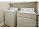 A cozy laundry room featuring a washer and dryer, perfect for convenience and efficiency at 2910 Lake James Ct, Monroe, NC 28110