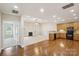Bright, open floor plan showcasing the kitchen, living area and fireplace at 2910 Lake James Ct, Monroe, NC 28110