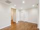 Spacious room with hardwood floors, white trim and neutral wall colors, perfect for entertaining at 2910 Lake James Ct, Monroe, NC 28110