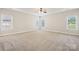 Spacious main bedroom with plush carpet, trey ceiling and natural light from multiple windows at 2910 Lake James Ct, Monroe, NC 28110