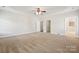 Bright main bedroom featuring a ceiling fan, neutral walls, and multiple entry points at 2910 Lake James Ct, Monroe, NC 28110