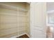 Walk-in pantry with ample shelving, ideal for organized storage and easy access to kitchen necessities at 2910 Lake James Ct, Monroe, NC 28110