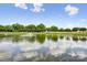 This home features a serene pond with a fountain, creating a peaceful and picturesque setting at 2910 Lake James Ct, Monroe, NC 28110