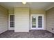 The sunroom features brick flooring and a door with windows, providing a seamless transition between indoors and outdoors at 2910 Lake James Ct, Monroe, NC 28110