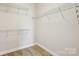 Walk-in closet features built-in shelving for optimal storage and organization at 2910 Lake James Ct, Monroe, NC 28110