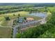 Aerial view of community facilities with a lake, garden plots, baseball, tennis, and shuffleboard at 3043 Santee Ct, Fort Mill, SC 29707