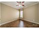 Bedroom featuring hardwood floors, a ceiling fan, and large windows at 3043 Santee Ct, Fort Mill, SC 29707