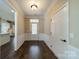 Home entryway with hardwood floors, wainscotting, and a view into the kitchen at 3043 Santee Ct, Fort Mill, SC 29707