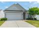 Charming home with a two-car garage, well-maintained lawn, and attractive landscaping at 3043 Santee Ct, Fort Mill, SC 29707