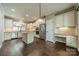 Spacious kitchen with white cabinets, stainless appliances, granite countertops, and hardwood floors at 3043 Santee Ct, Fort Mill, SC 29707