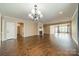 Open-concept living room with fireplace and hardwood floors, ideal for entertaining guests at 3043 Santee Ct, Fort Mill, SC 29707